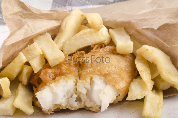 fish and french fries in a brown bag