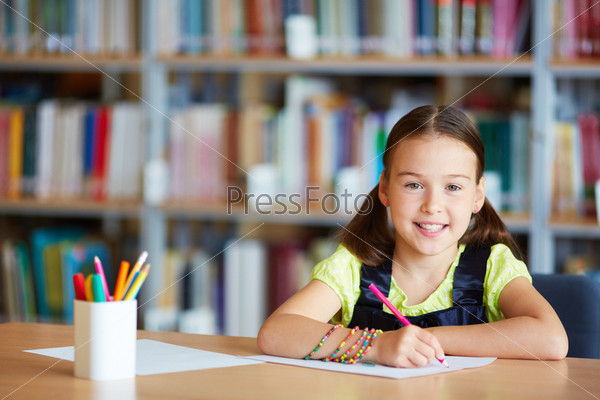 Portrait Of A Lovely Girl Drawing With Pencil In Library