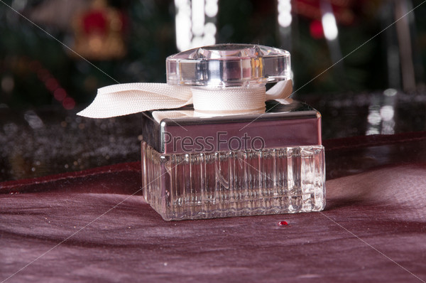 perfume bottle on the table and Christmas Tree