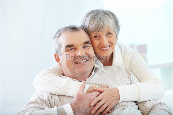 Portrait of a happy senior couple looking at camera