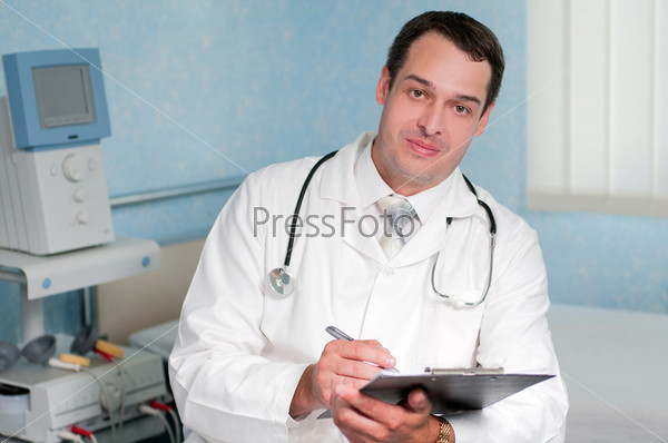Portrait of a young smiling doctor at the medical center