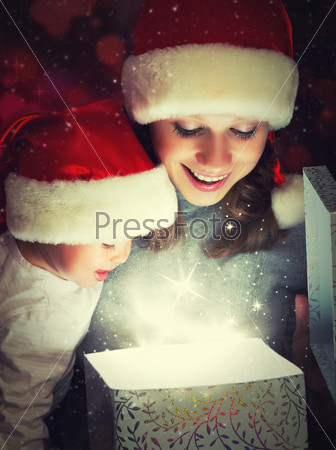Christmas Magic Gift Box And A Woman Happy Family Mother And Child Baby