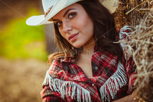 beautiful cowgirl style closeup model model on farmland