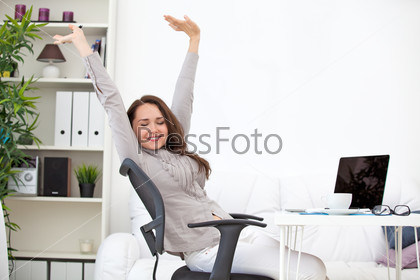 Woman stretching at workplace