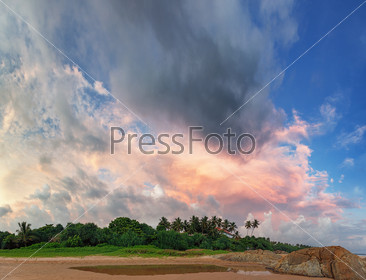 Beautiful sky over the tropical ocean coast in the evening