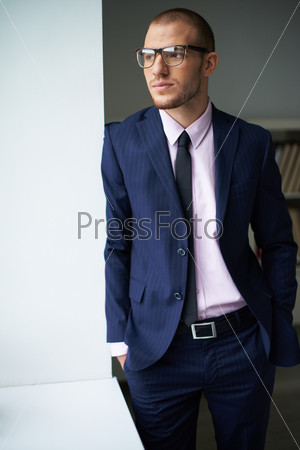 Portrait of elegant man in suit and eyeglasses
