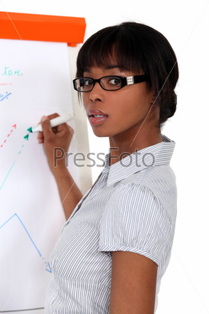 black female executive making presentation during meeting