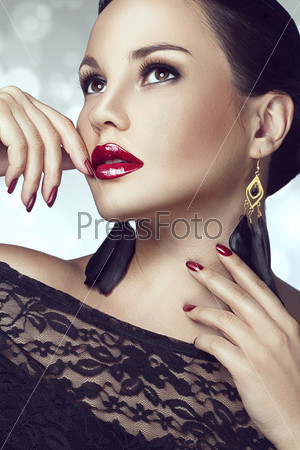 Portrait of beautiful woman with perfect make up over party lights