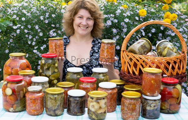 Woman with home canning for the winter