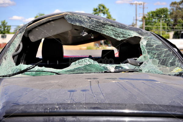 Close-up of car hood  and its broken windshield