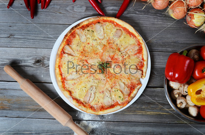 Sweet pizza with chicken and pineapples