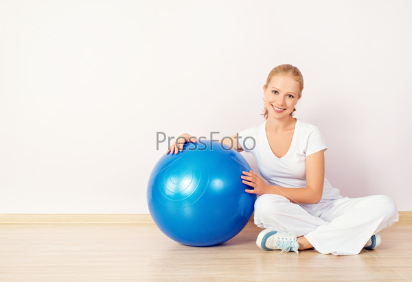 Happy young woman and a sports ball for fitness, stock photo