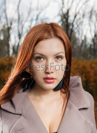 foxy-red haired women outdoors weared jacket at autumn time