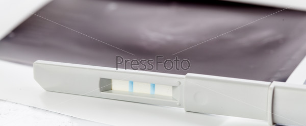 Positive pregnancy test and ultrasound of baby