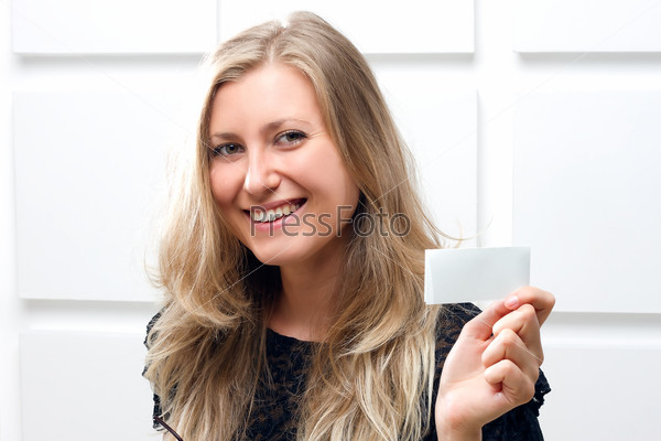 Portrait of smiling business woman giving blank business card, stock photo