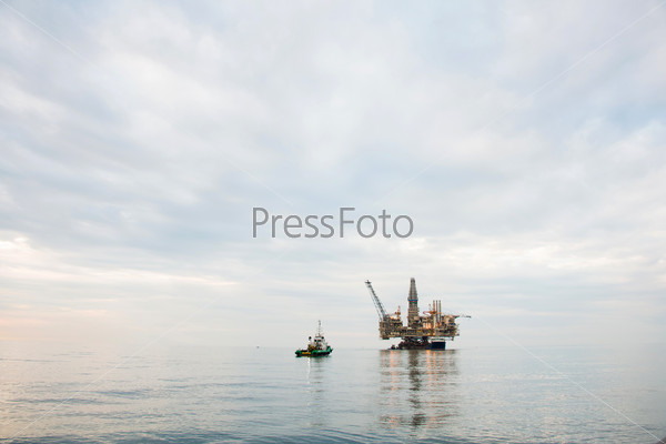 Oil Rig Being Tugged In The Sea