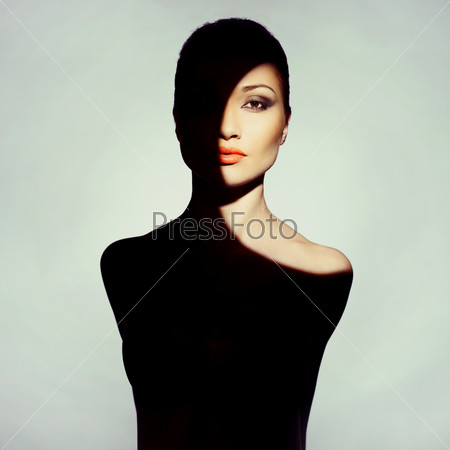 Surrealistic young lady with shadow on her body