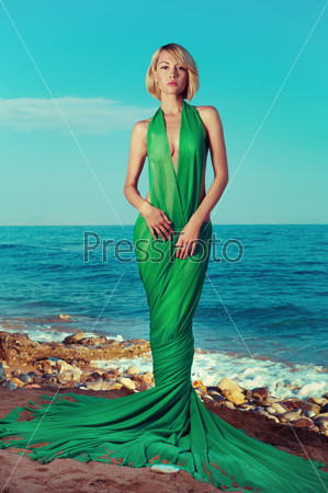 Beautiful nymph on the ocean. Fashion photo