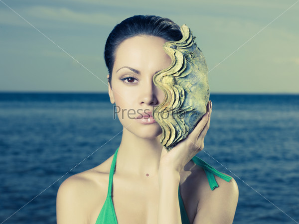 Portrait Of A Beautiful Young Lady With A Large Sea Shell