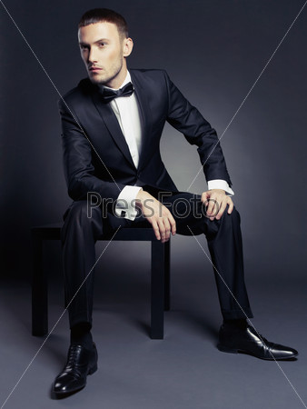 Portrait Of Handsome Stylish Man In Elegant Black Suit