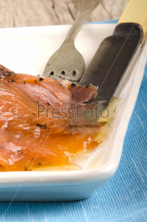 spicy wild salmon with sweet honey, fork and knife