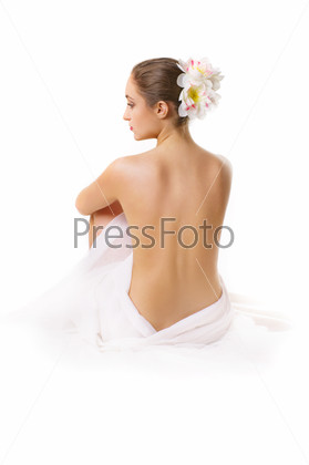 Young woman, sitting with a bare back.