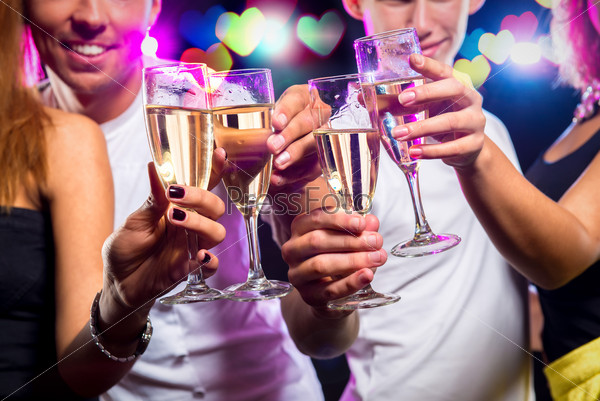 Group of people with glasses of sparkling champagne over abstract background
