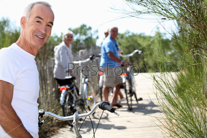 senior men and women riding bicycles
