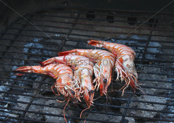 Cooking tiger prawns grilled. Close-up. Background. Outdoor.