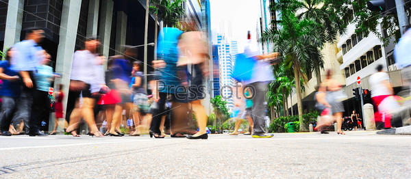 Unidentified businessmen crossing the street in Singapore. There are more than 7,000 multinational corporations from US States, Japan and Europe in Singapore