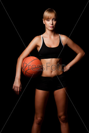 Woman standing with basketball