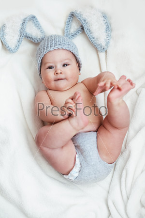 Portrait of a cute 6 months baby wearing rabbit hat
