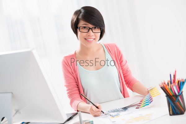Copy-spaced portrait of a freelance retoucher working with colors at home on the foreground