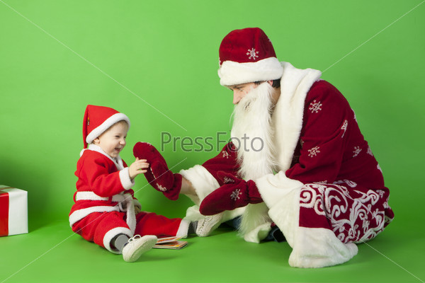 Father and son wearing Santa costume