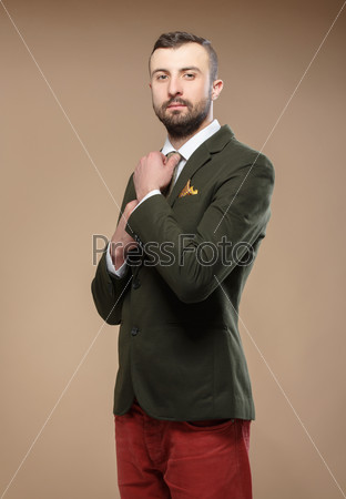 Young man in a green suit and tie