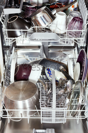 Dirty cookware in open dishwasher