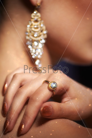 Soft focus portrait of beautiful young woman with hand on shoulder
