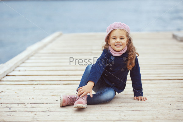 Portrait Of 4 Years Old Girl Walking On Berth Near Sea In The City, Still Life Photo