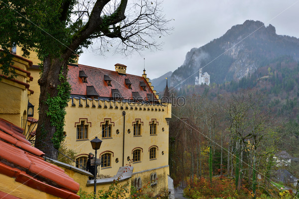 Hohenschwangau castle in Germany. View with mountains. Raining frog mood.