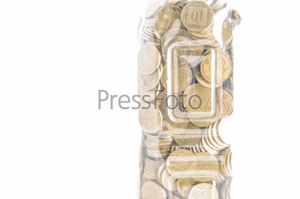 Fragment of plastic bottle with coins on white\
background