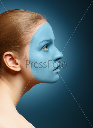 Young girl with facial mask.