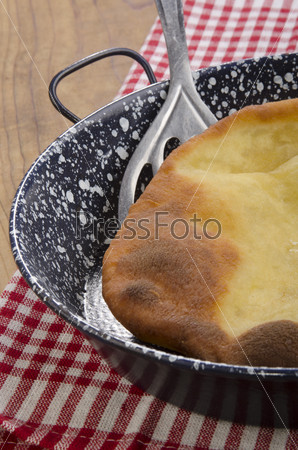 Langos, home made Hungarian pancake in a pan