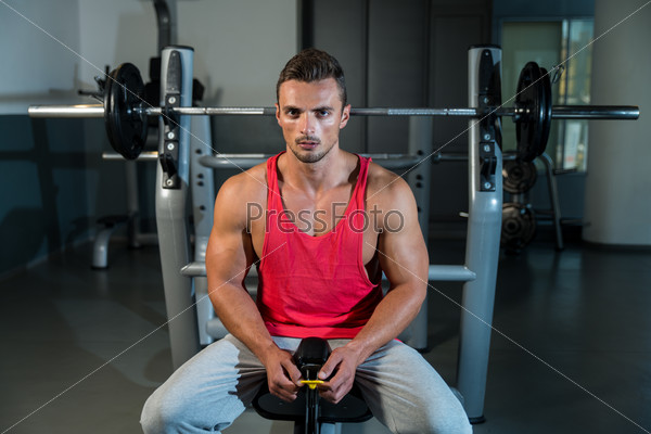 Pause After Effort. Portrait Of A Young Muscular Sporty Fit Caucasian Man Resting At The Bench