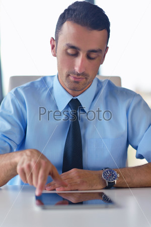 Business man using tablet compuer at office