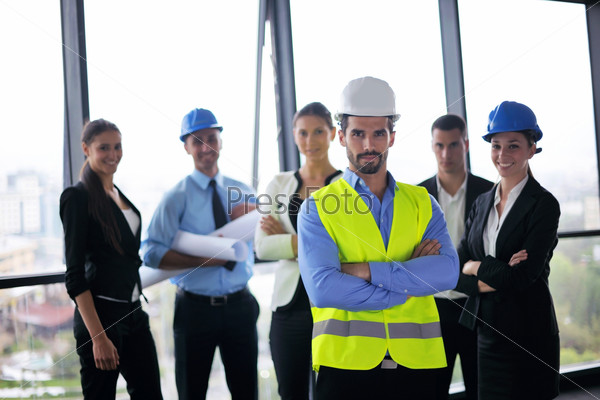 business people and construction engineers on meeting