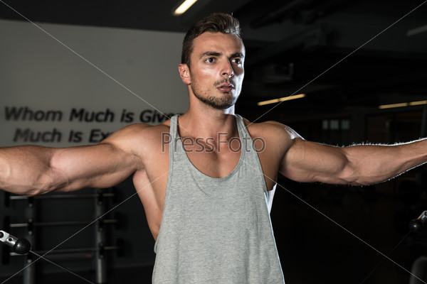 Body Builder Workout On Cable Machine, stock photo
