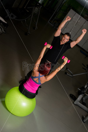 Fitness Couple Exercise in the gym, stock photo