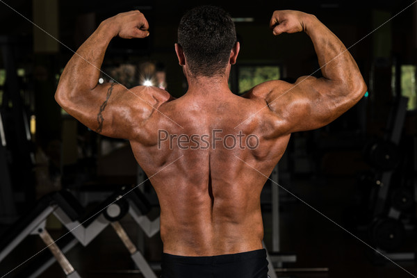 bodybuilder showing his back double biceps