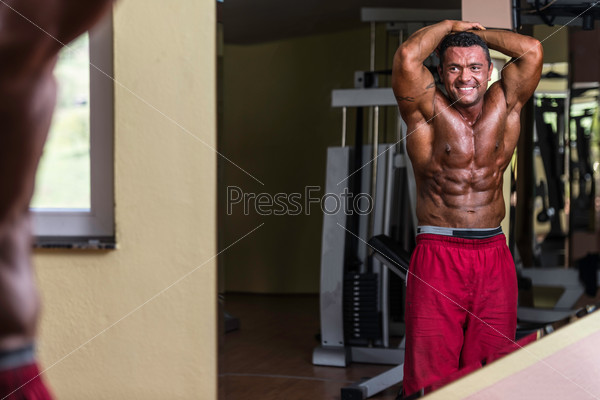 Body builder showing abs, stock photo