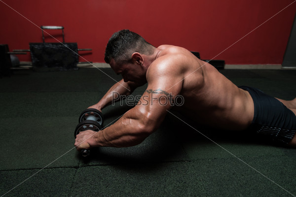 Working Out With Ab Roller, stock photo